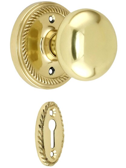Rope Rosette Mortise Lock Set With Round Brass Knobs in Polished Brass finish.